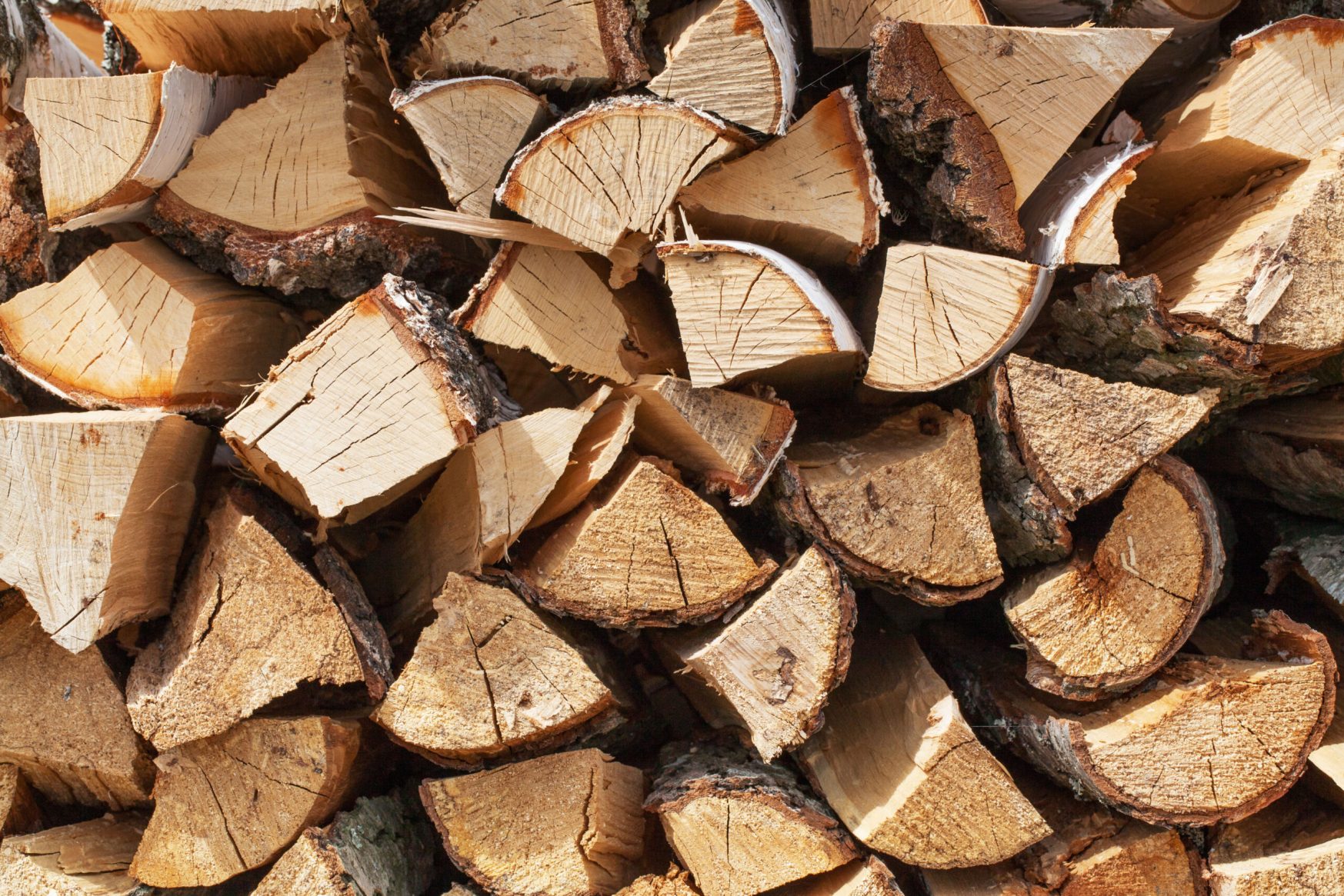 Background of dry chopped firewood logs in a pile ; Shutterstock ID 142233751; PO: Zeus